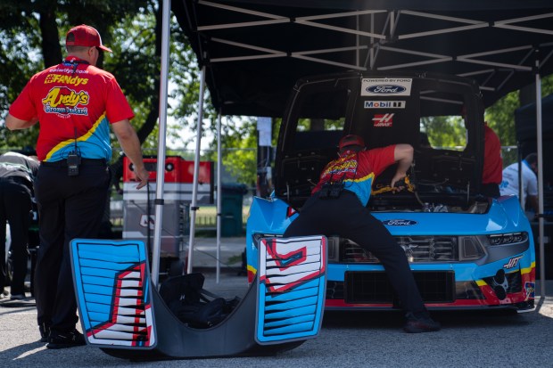 Haas/Andy's workers attend to their race car at the NASCAR...