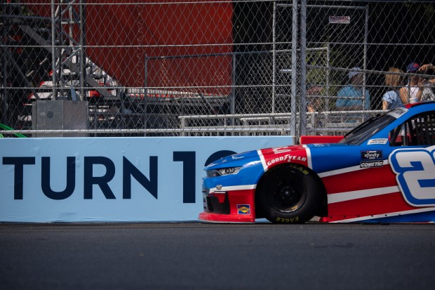 Thompson Pipe Group’s Dean Thompson (26) comes around Turn 12...