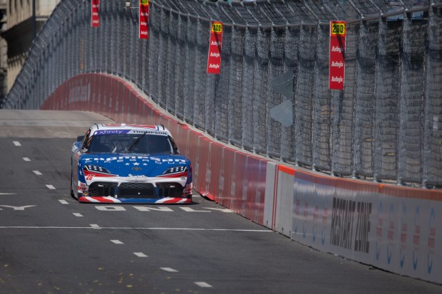 Thompson Pipe Group’s Dean Thompson (26) comes around Turn 12...