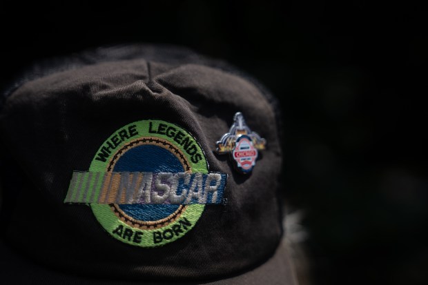 Mike Piotrowski, of Union Pier, Mich., shows his NASCAR hat,...