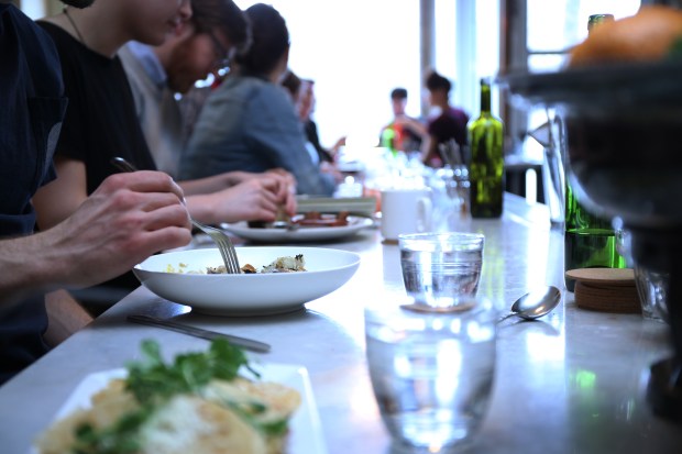Diners eat at the bar at Lula Cafe in 2016, in Chicago's Logan Square neighborhood. (John J. Kim/Chicago Tribune)