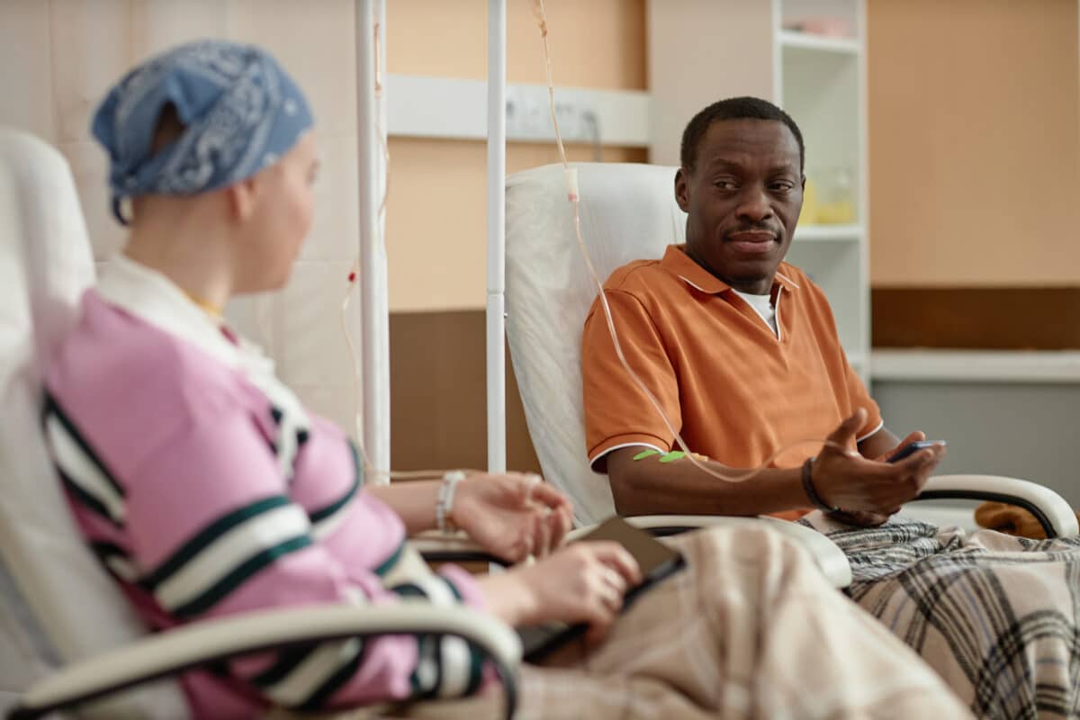 Cancer patients having a conversation while receiving chemotherapy