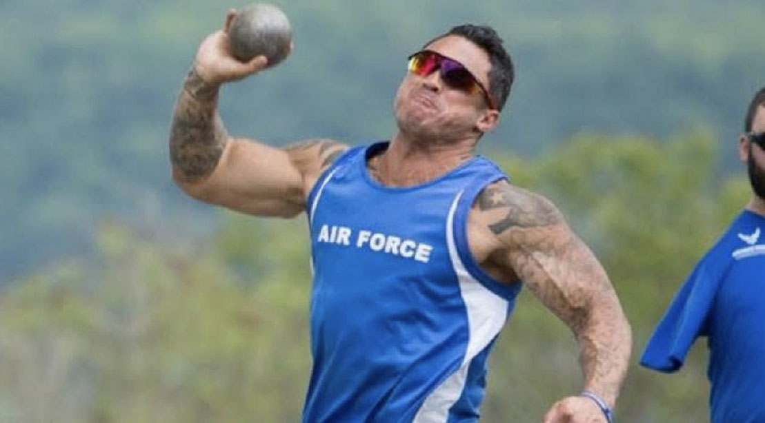 Chris Ferrell throwing a shotput