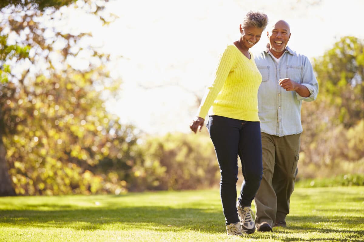 Senior couple walking outside