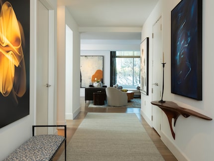 The entry way makes an artful statement as you walk into the condo. On the left is "No. 156"...