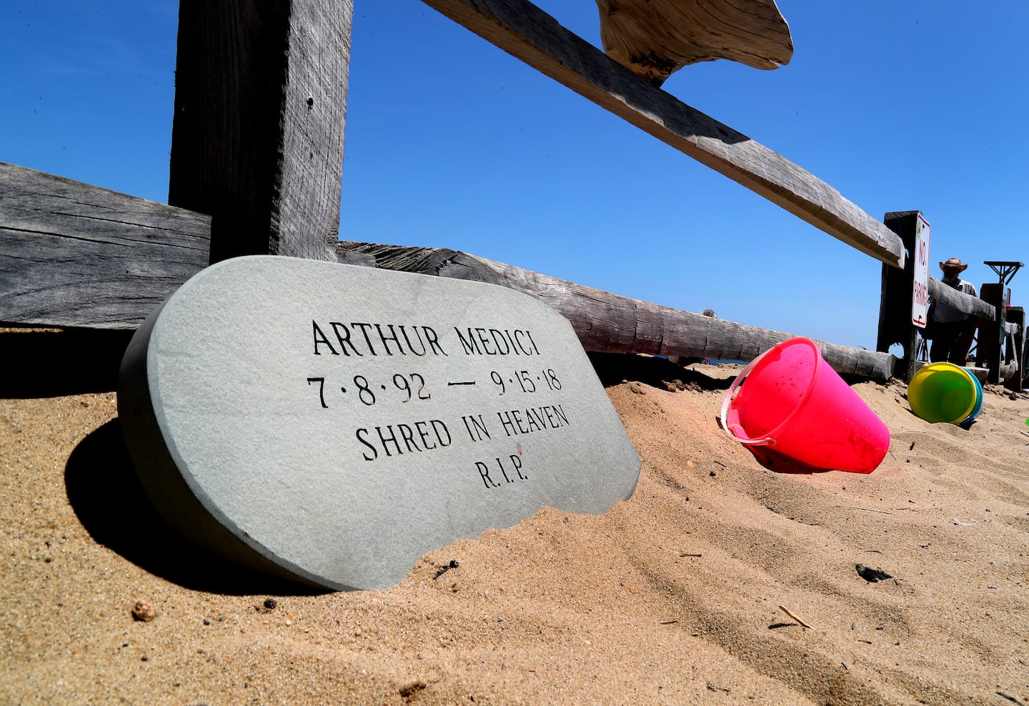 A memorial in July 2024 at Newcomb Hollow Beach for Arthur Medici, who was killed by a shark while surfing off the beach in 2018.