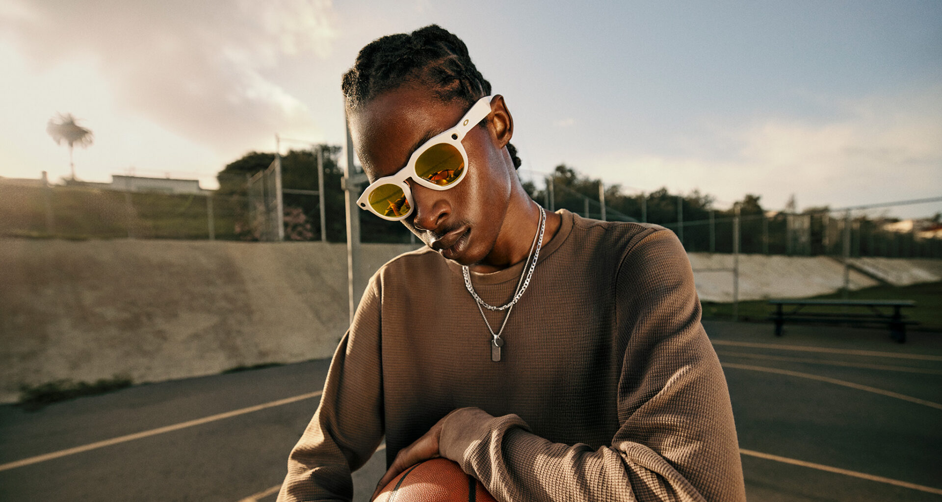 Official lifestyle shots of a person wearing Oakley Meta HSTN smart glasses
