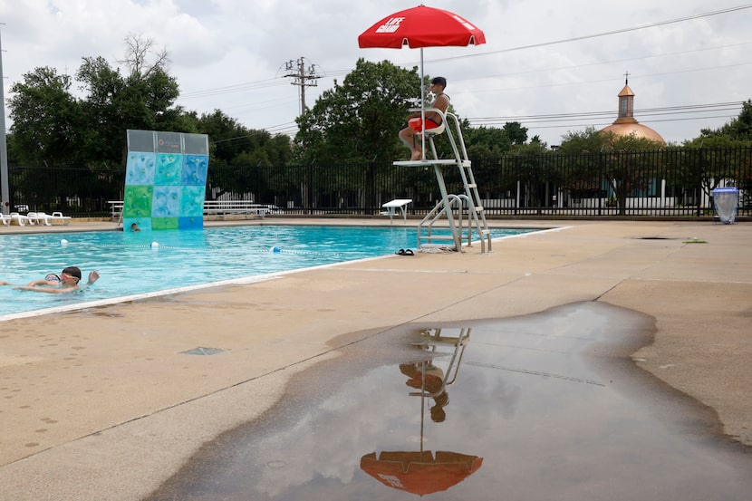 People swim in Walnut Hill Swimming Pool, Wednesday, July 2, 2025, in Dallas. 