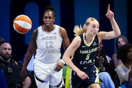 Dallas Wings guard Paige Bueckers (5) celebrates after scoring past Las Vegas Aces guard...