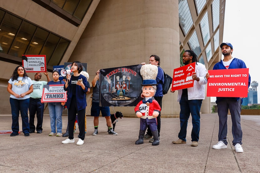 Cindy Hua, Downwinders at Risk board chair (center left), speaks during a news conference to...