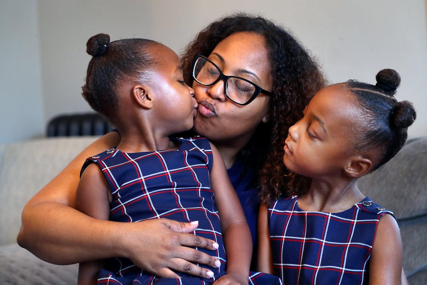 Diana Cortes got a kiss from her daughter, Layla, 3 as her sister  Arya, looks on. Layla had a liver transplant in June 2023.