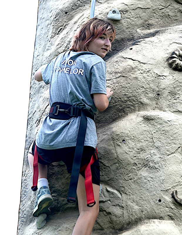 Allison Homa, 14 of Media climbs the rock wall. "I learned a bunch of stuff, rifles, archery, we learned how to march, how the do the military procedure. It's kind of cool, the rhythm of it," she said. (PETE BANNAN-DAILY TIMES)