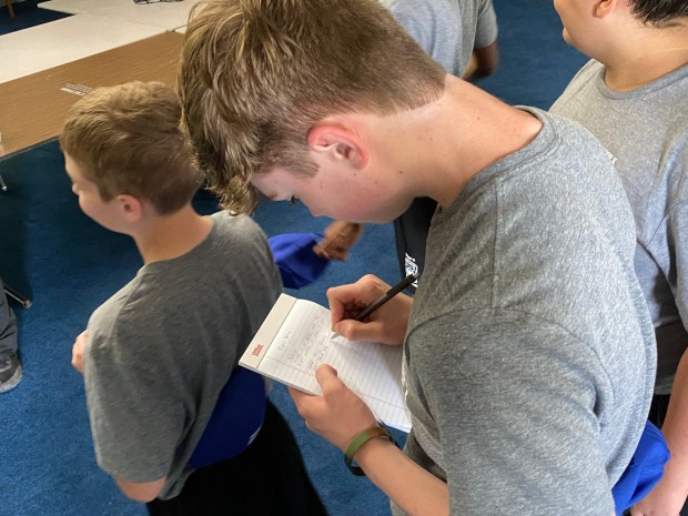 A cadet takes notes during classes on crime scene investigation at the Pennsylvania State Police Camp Cadet held at Valley Forge Military Academy this week. (PETE BANNAN-DAILY TIMES)