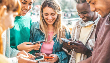 Young people with mobile phones.