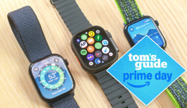 Apple Watch 10, Apple Watch SE, and Apple Watch Ultra 2 next to each other on a wooden table