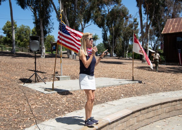 Organizer Carol Knight makes announcements at the 2025 Olivenhain 4th...