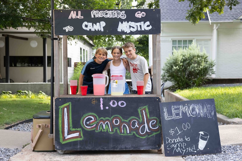 (From left) Caden Wallace, 12, Everly Wallace, 10, and Graham Goodin, 12, pose for a photo...