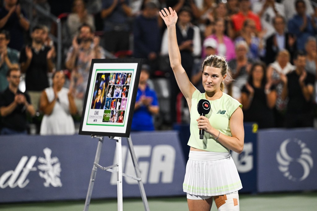 An emotional Eugenie Bouchard waves to the crowd during her reitirement ceremony after she fell to No. 17 seed Belinda Bencic, 6-2, 3-6, 6-4 in the final singles match of her professional tennis career.