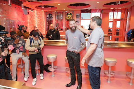 Raising Cane's has a reputation for partnering with celebrities. Here's Todd Graves, center...