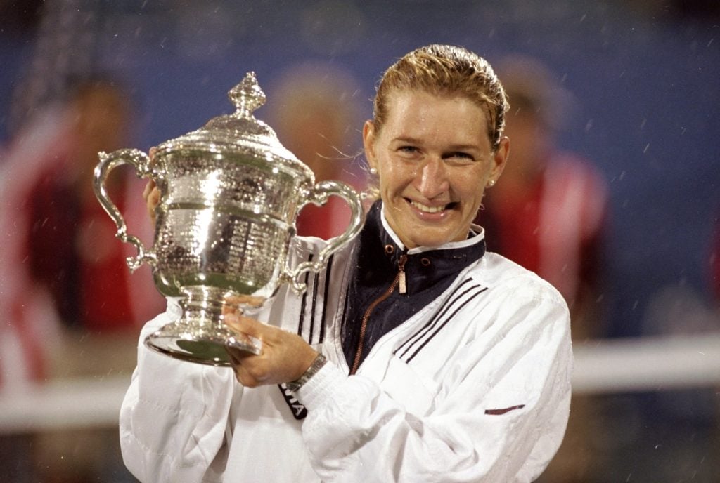 Steffi Graf celebrates with the US Open title in 1996
