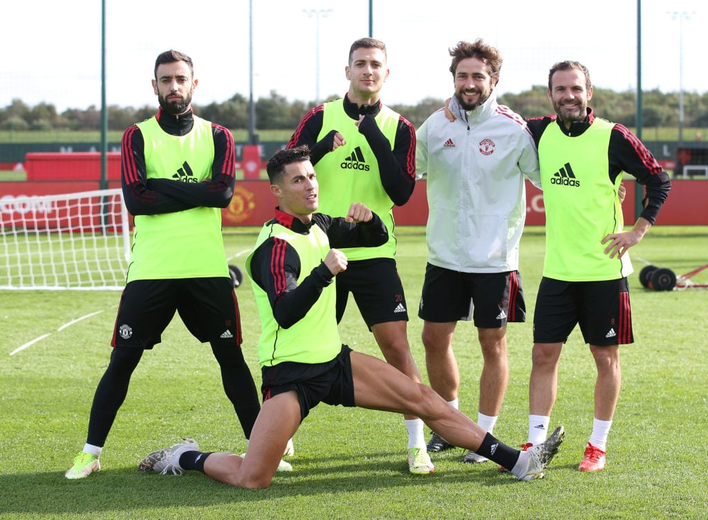 Cristiano Ronaldo, Bruno Fernandes, Diogo Dalot, Juan Mata, Coach Paolo Gaudino of Manchester United in action during a first team training session at Carrington, October 1, 2021