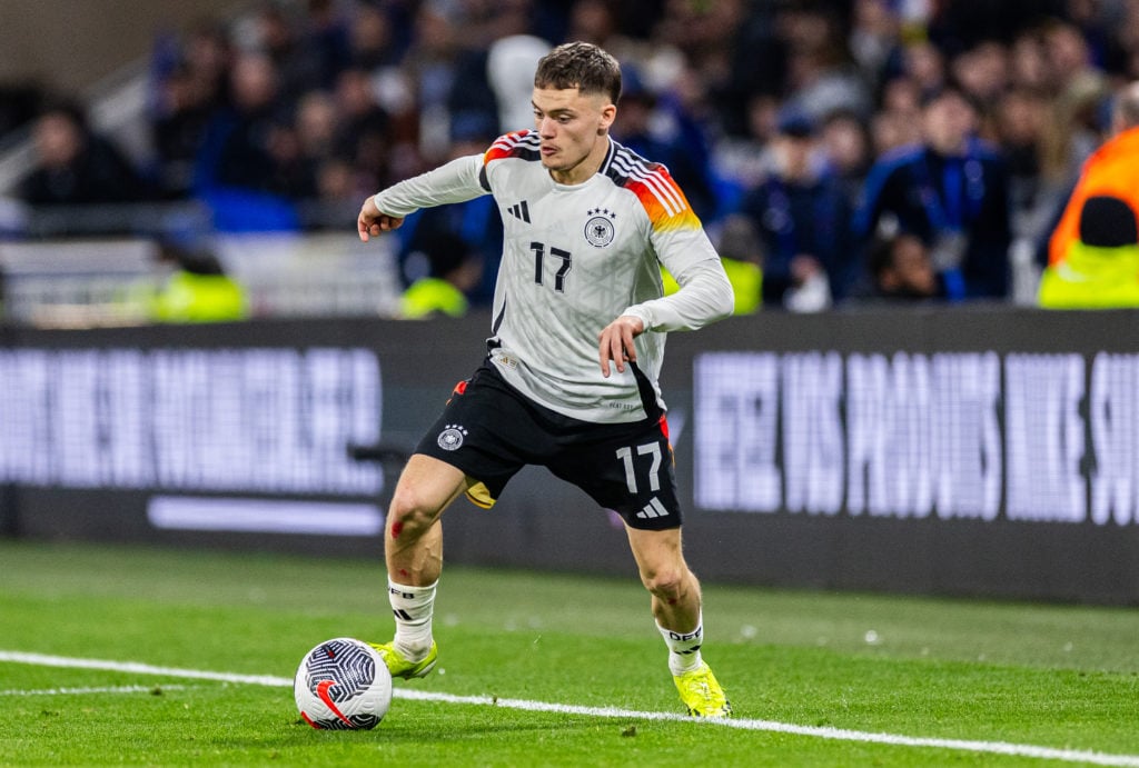 Florian Wirtz of Germany runs with the ball during the international friendly match between France and Germany