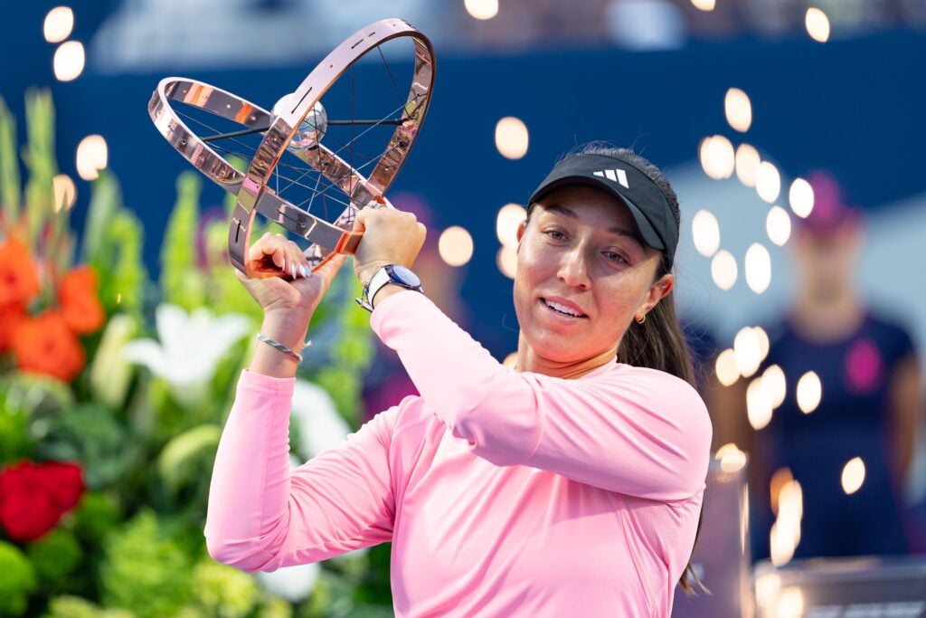 Jessica Pegula of the United States lifts the championship trophy after winning the National Bank Open tournament.