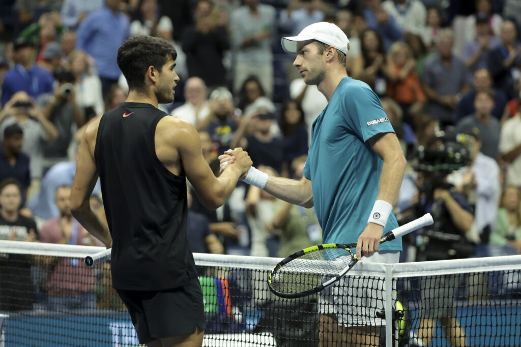 Botic van De Zandschulp of the Netherlands shakes hands with Carlos Alcaraz of Spain after winning their Men's Singles Second Round match on Day Four of the 2024 US Open at USTA Billie Jean King National Tennis Center on August 29, 2024 in the Flushing neighborhood of the Queens borough of New York City.