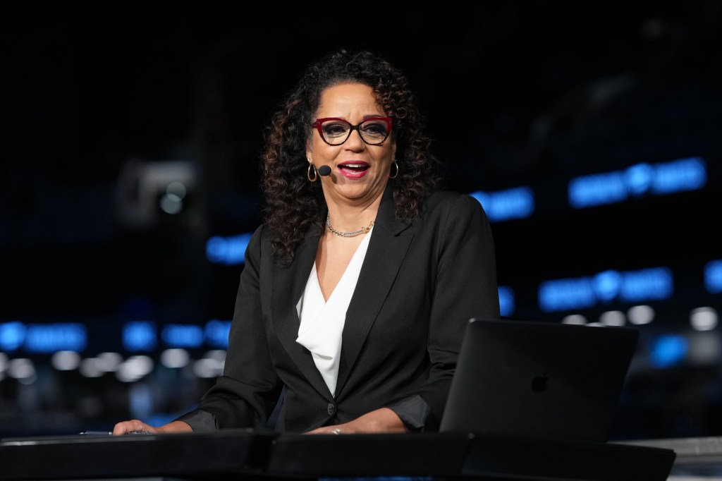 Carolyn Peck speaking at a podium.