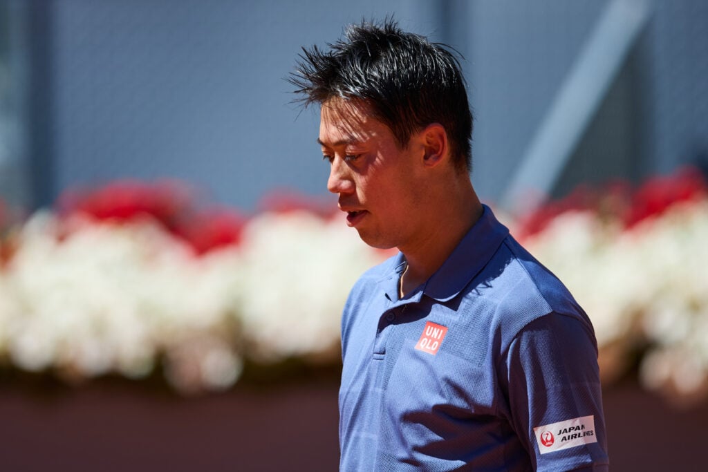 Kei Nishikori looks on during his match with Aleksandar Vukic at the 2025 Madrid Open.