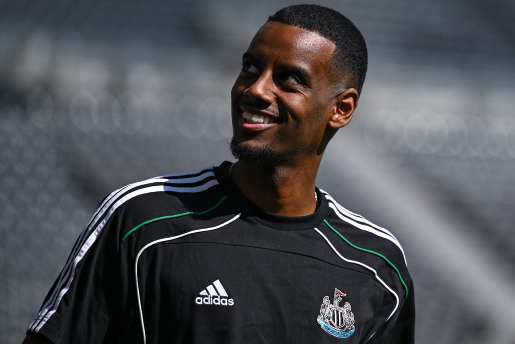 Newcastle United striker Alexander Isak smiles wearing training gear before match against Chelsea