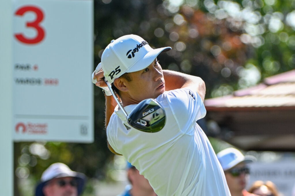 Collin Morikawa tees off on the third hole during round one of the Rocket Classic