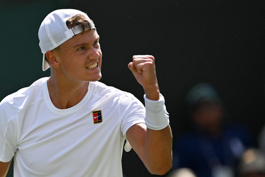 Holger Rune celebrates during his first-round match against Nicolas Jarry at Wimbledon in 2025
