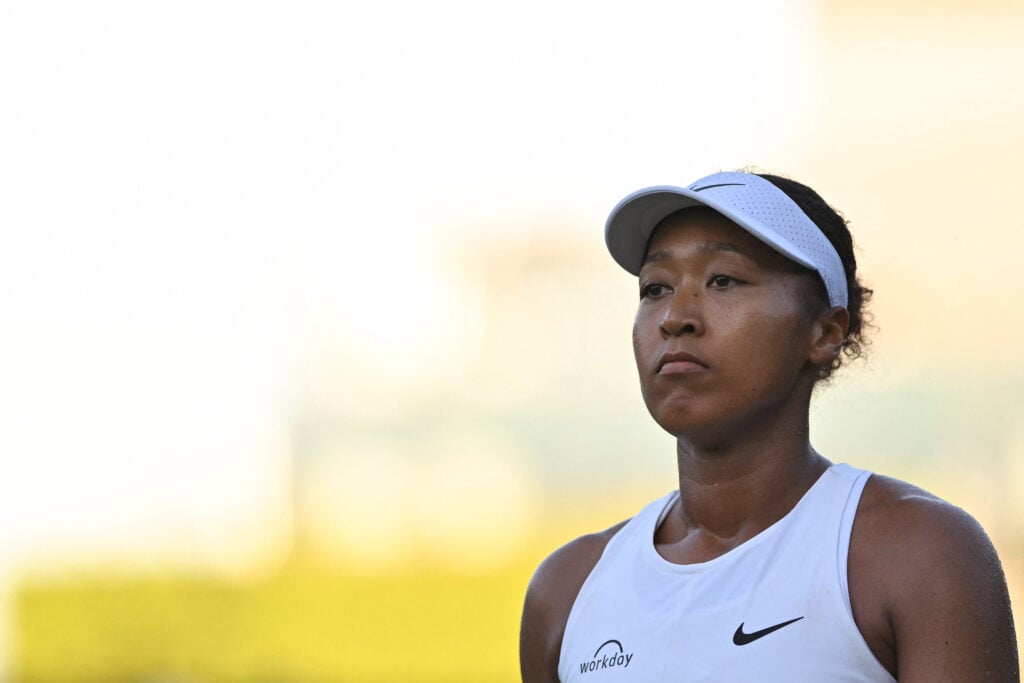 Naomi Osaka looks on during her first round match at Wimbledon in 2025