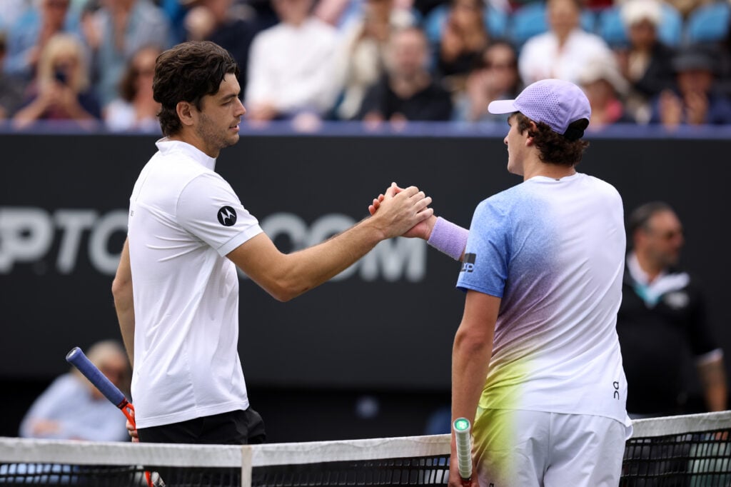 Taylor Fritz and Joao Fonseca embrace after their match at Wimbledon in 2025