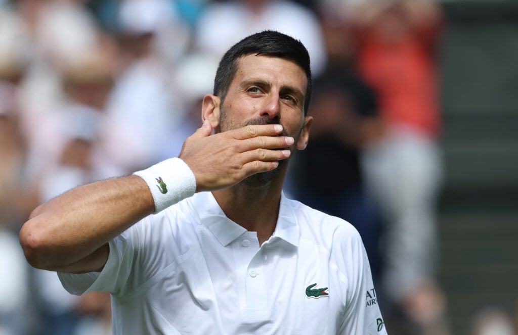 Novak Djokovic acknowledges the crowd at Wimbledon in 2025.