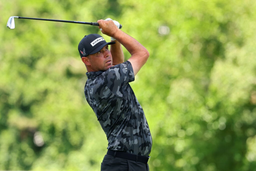Gary Woodland hits his tee shot on the 9th hole during the third round of the Rocket Classic