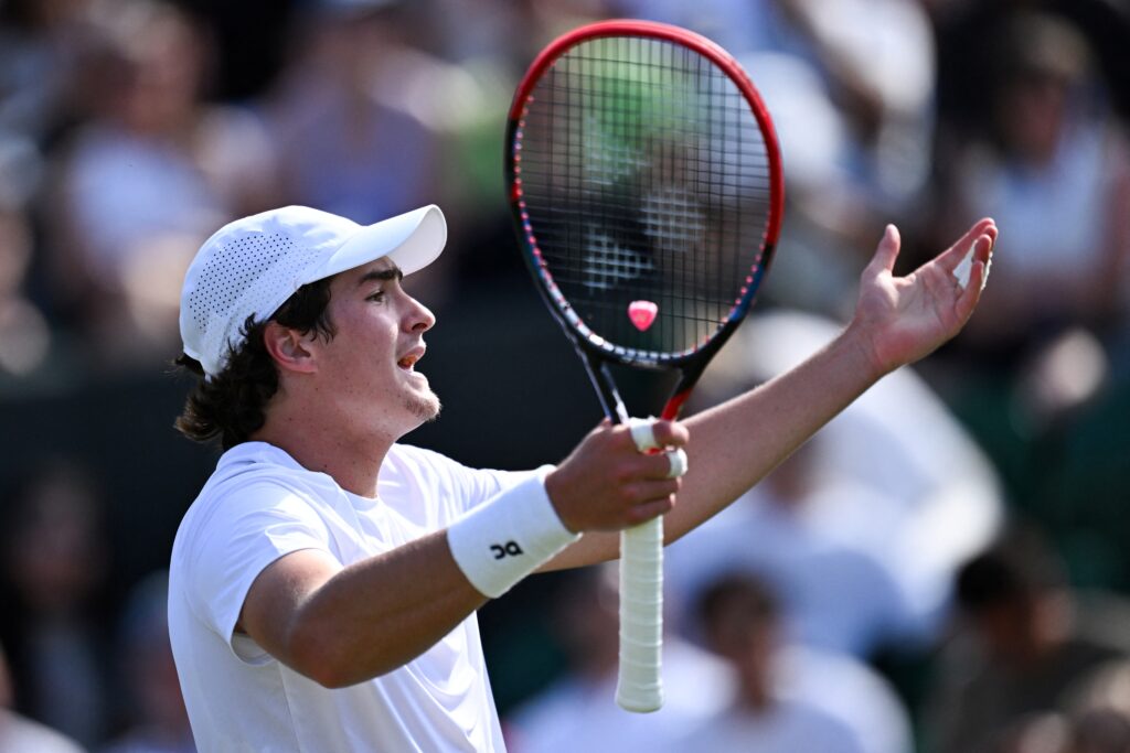 Brazil's Joao Fonseca reacts as he plays against Chile's Nicolas Jarry during their men's singles third round tennis match on the fifth day of the 2025 Wimbledon Championships at The All England Lawn Tennis and Croquet Club in Wimbledon, southwest London, on July 4, 2025.