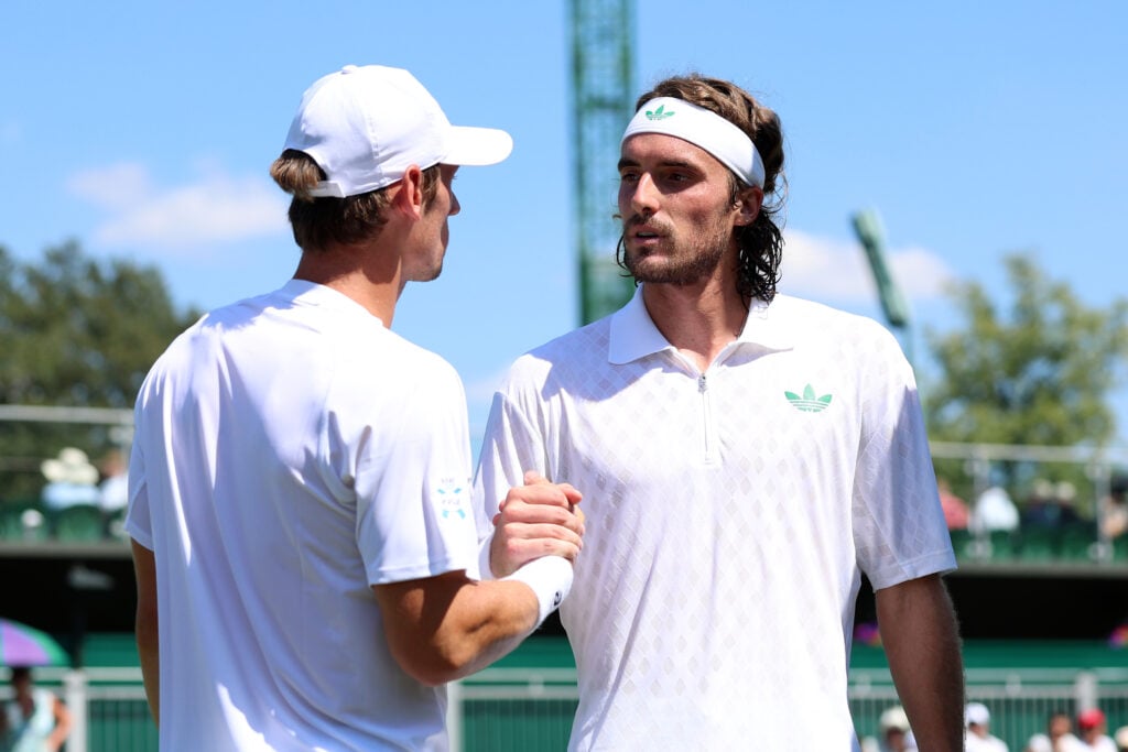 Stefanos Tsitsipas and Valentin Royer shake hands after their first-round match at Wimbledon.