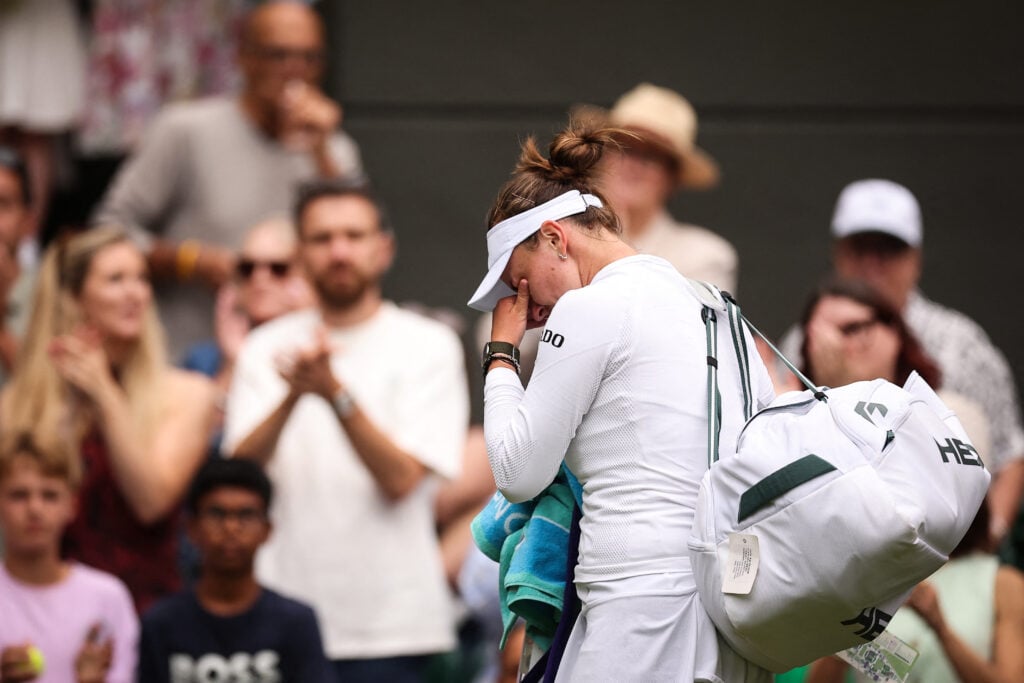 Barbora Krejcikova cries as she leaves Court 1 following her defeat against USA's Emma Navarro at the end of their women's singles third round tennis match on the sixth day of the 2025 Wimbledon Championships at The All England Lawn Tennis and Croquet Club.