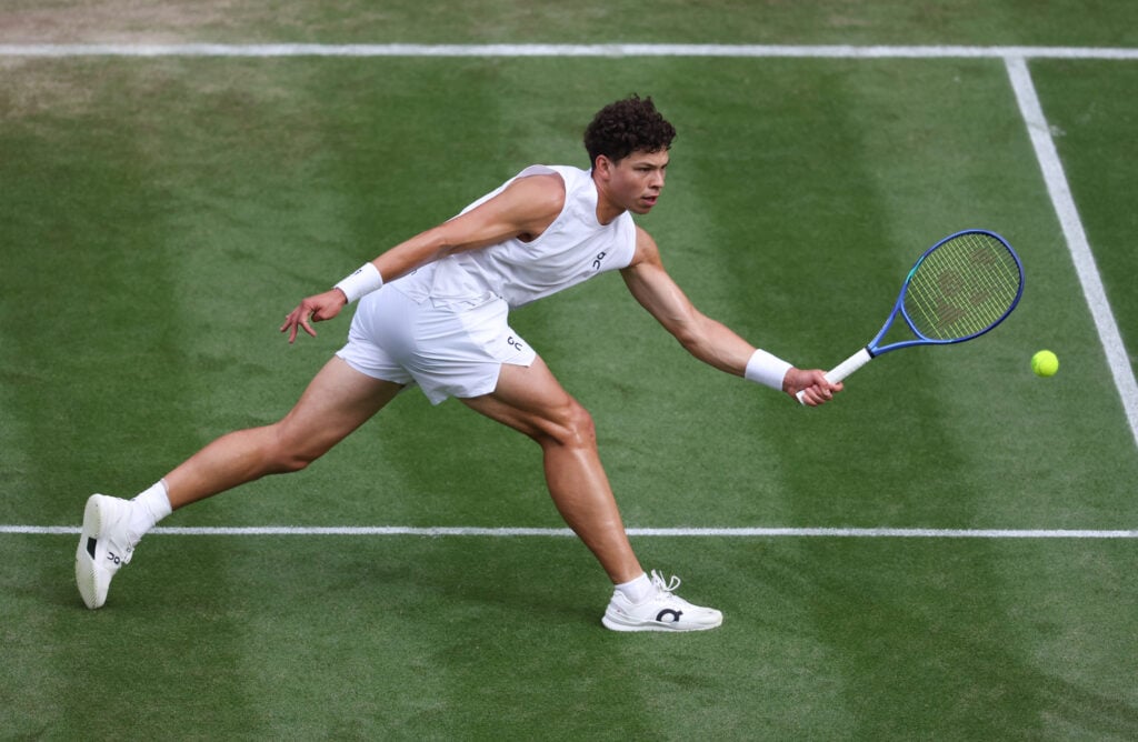 Ben Shelton stretches for a forehand