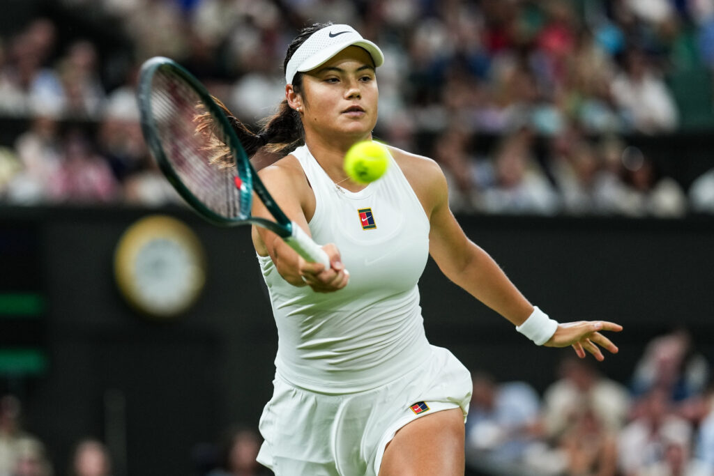 Emma Raducanu of United Kingdom plays a forehand in the Ladies' Singles Third Round match against Aryna Sabalenka on day five of The Championships Wimbledon 2025 at All England Lawn Tennis and Croquet Club on July 04, 2025 in London, England.