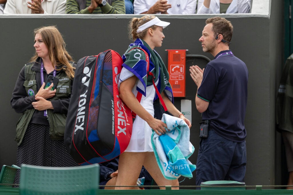 Elena Rybakina heads off court after losing to Clara Tauson at Wimbledon