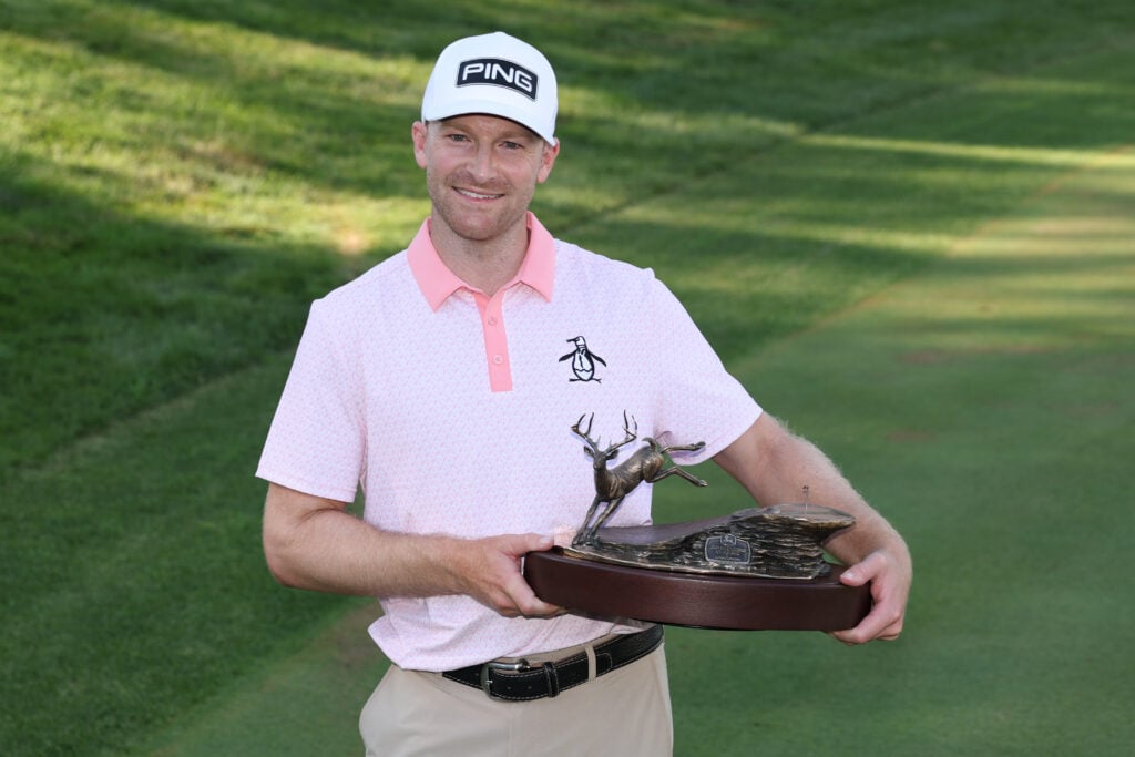 Brian Campbell holds the winner's trophy after winning the 2025 John Deere Classic