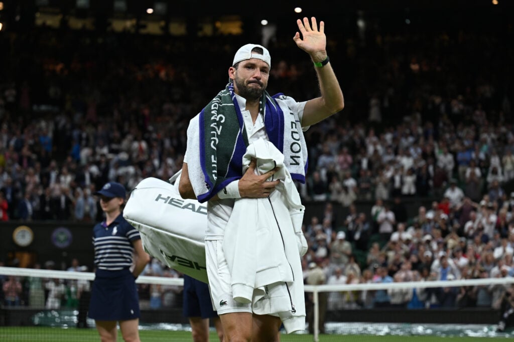 Grigor Dimitrov waves goodbye to fans after retiring injured against Jannik Sinner at Wimbledon