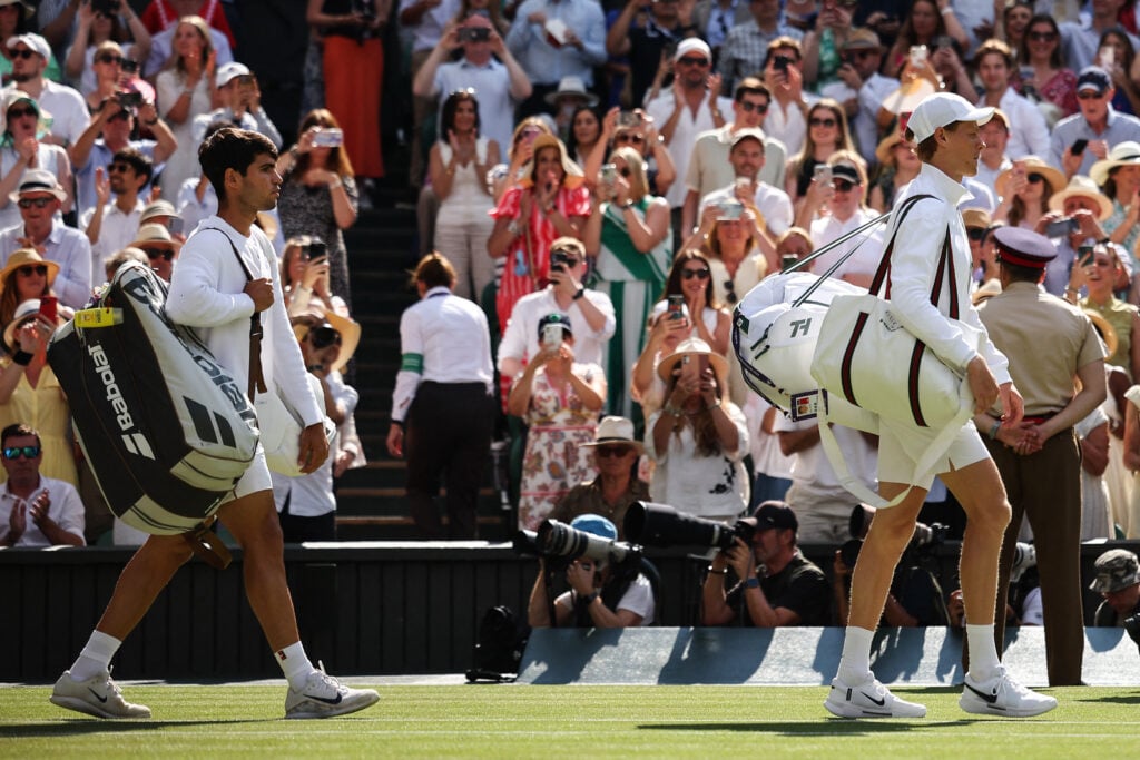 Carlos Alcaraz and Jannik Sinner walk on court ahead of the 2025 Wimbledon final