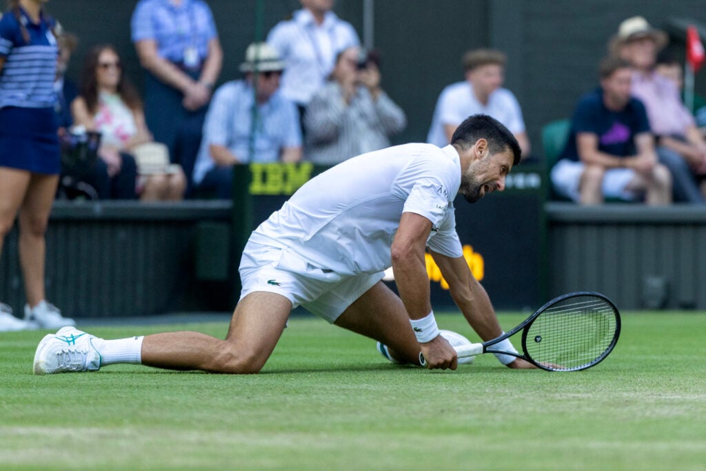 Novak Djokovic falls awkwardly against Flavio Cobolli in the Wimbledon quarterfinals