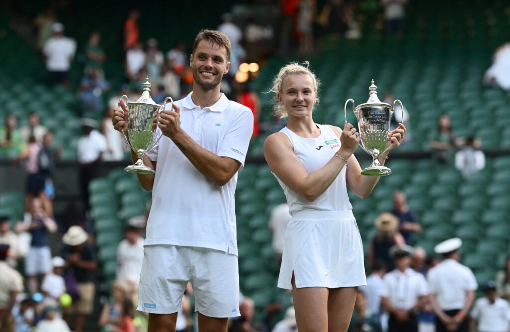 Sem Verbeek of Netherlands and partner Katerina Siniakova of Czechia pose for a photo with the Mixed Doubles Trophies following their victory against Joe Salisbury of Great Britain and Luisa Stefani of Brazil in the Mixed Doubles Final on day eleven of The Championships Wimbledon 2025 at All England Lawn Tennis and Croquet Club.