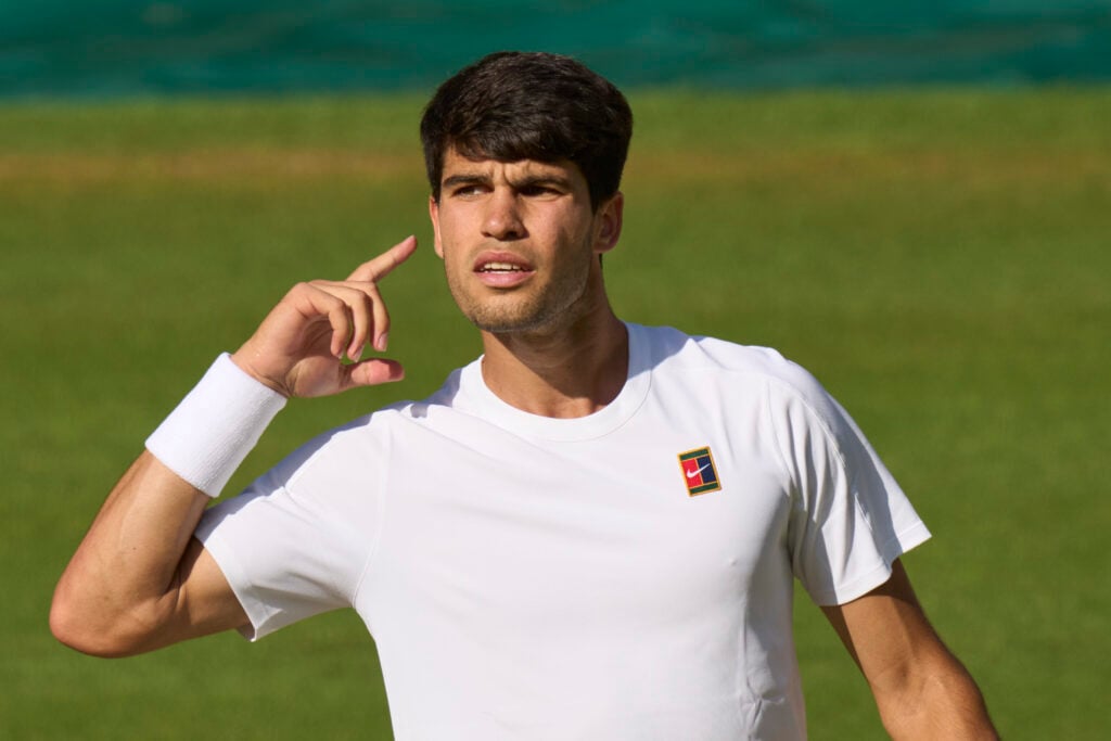 Carlos Alcaraz of Spain reacts as he takes the first set against Jannik Sinner of Italy during Gentlemen's singles final on Centre Court on day fourteen of The Championships Wimbledon 2025 at All England Lawn Tennis and Croquet Club.