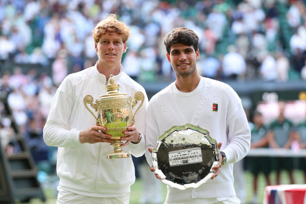 Carlos Alcaraz and Jannik Sinner pose for pictures after the 2025 Wimbledon final
